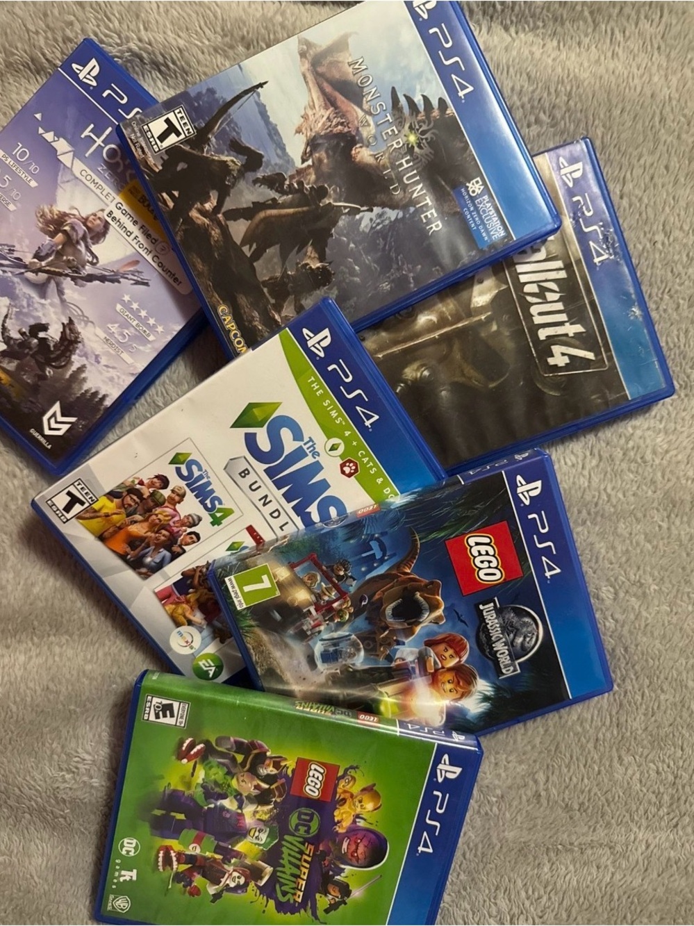 Sony PS4 Game Lot with Blue Cases and Colorful Cover Art